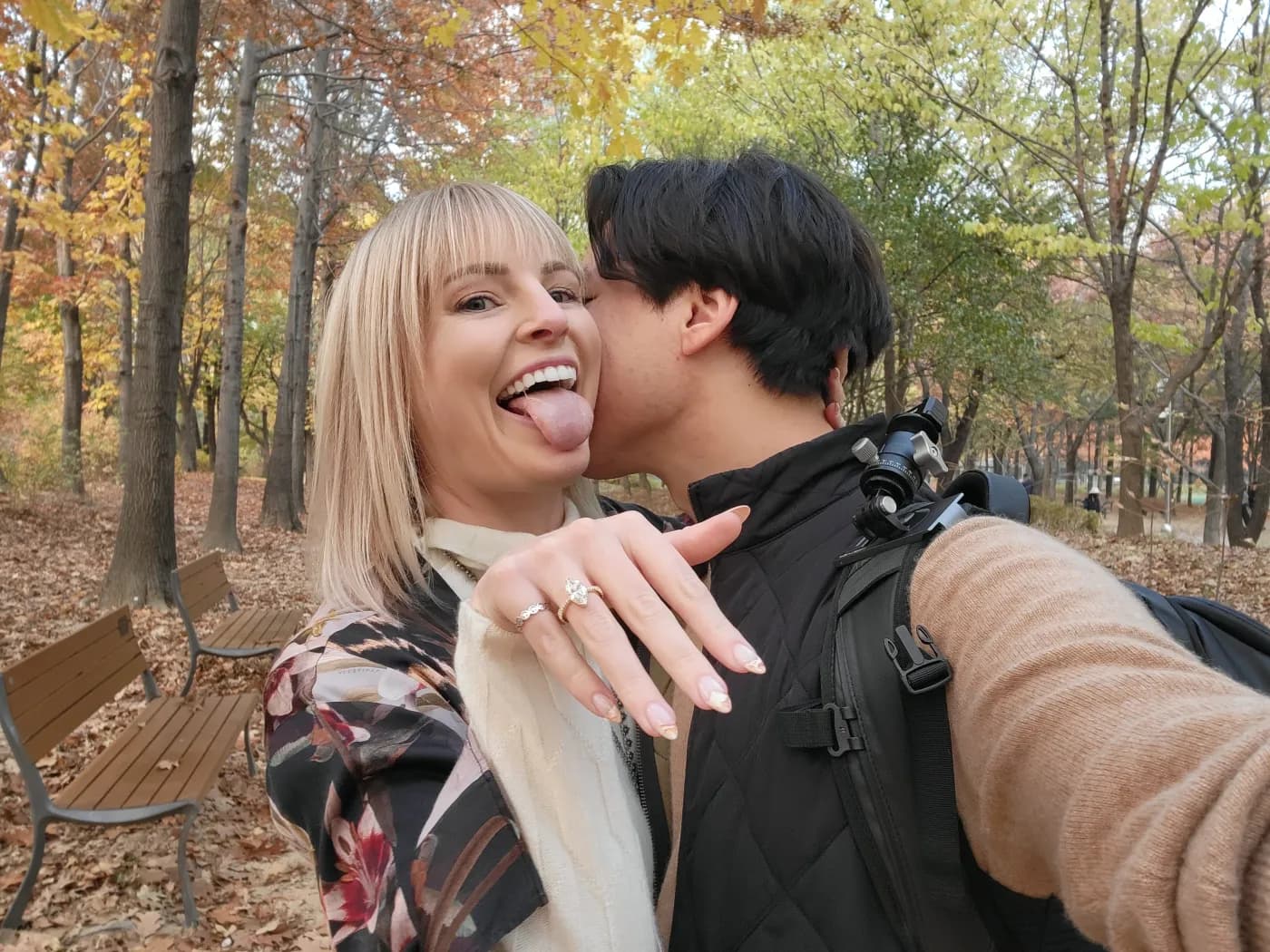 Carolyn and Daniel after the proposal among golden gingko trees